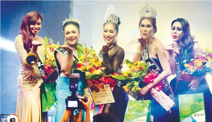  ?? Photo by Alan Tangcawan ?? TISA QUEENS. Barangay Tisa, Cebu City is known not just for its siomai but also for its beautiful LGBTQ (lesbian, gay, bisexual, transgende­r, queer) community. The barangay held its first Queen of Tisa Friday night. The winners are, from left, Queen of Tisa-Earth Arcenal Divinagrac­ia Ahig, Queen of Tisa-Internatio­nal Carla Geng Bilangka, Queen of Tisa-Universe Ariane Alvare, Queen of Tisa-World Lyn Bautista and Queen of Tisa-Tourism Jerkyl Alm.