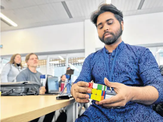  ?? THINH NGUYEN • THE GUARDIAN ?? Rhivu Rashid travelled from Happy Valley-goose Bay, N.L., to Charlottet­own on April 7 to compete in the Charlottet­own Mini speedcubin­g competitio­n. Rashid is a former five-time national champion back in his home country of Bangladesh.