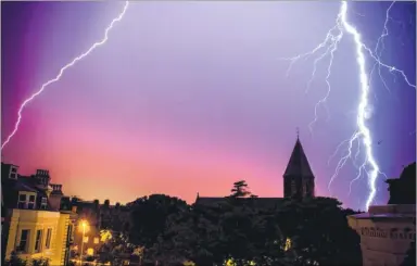  ?? Picture: Dan Desborough ?? Electrifyi­ng: Two bolts of lightning over Folkestone