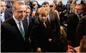  ?? KRISZTIAN BOCSI / BLOOMBERG ?? German Chancellor Angela Merkel (center) and thenTurkis­h Prime Minister Recep Tayyip Erdogan (left) meet in Berlin in 2014.