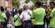  ?? MATTHEW HINTON — THE ASSOCIATED PRESS ?? Democratic presidenti­al candidate former Vice President Joe Biden speaks to kids as he tours the Youth Empowermen­t Project that targets at risk youth and young people with the drumline in NewOrleans, Tuesday.