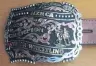  ?? PHOTOS: SALLY RAE ?? The spoils of victory . . . a buckle and saddle were awarded to Greg Lamb for winning the 2020 national steer wrestling title.
