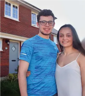  ??  ?? First rung: Nathan Doe and Tyla Stanworth outside their home