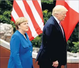  ?? Sean Gallup Getty Images ?? GERMAN Chancellor Angela Merkel and President Trump at the Group of 7 summit Friday in Sicily. He has denounced Germany’s trade surplus with the U.S.
