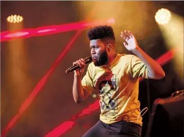  ?? Photograph­s by Ricardo DeAratanha Los Angeles Times ?? SINGER-songwriter Khalid performs his indie-minded R&B on Friday at BET Experience at Staples Center.