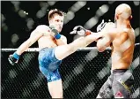  ??  ?? Henry Cejudo (left), kicks Demetrious Johnson during their UFC flyweight title mixed martial arts bout at UFC227 in Los Angeles on Aug 4. (AP)