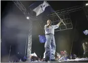  ?? ELMER MARTINEZ — THE ASSOCIATED PRESS ?? National Party presidenti­al candidate Nasry Asfura waves a flag during a closing campaign rally in Tegucigalp­a, Honduras, on Sunday.