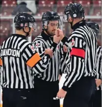  ?? HICKLING IMAGES PHOTO ?? Officials get together during the OHL Gold Cup in Kitchener, including Waterdown’s Matt Davidson, left.