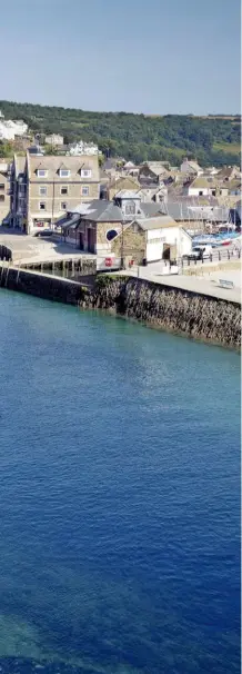  ??  ?? A view into Looe, with its colour-washed homes climbing up from the azure waters, and its quayside.