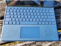  ?? ?? The Surface Pro Signature Keyboard hides the Slim Pen 2, tucked underneath the fold.