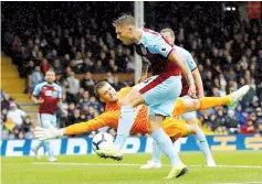  ?? — Reuters photo ?? Burnley’s Jeff Hendrick scores a goal during the Premier League match against Fulham in London.