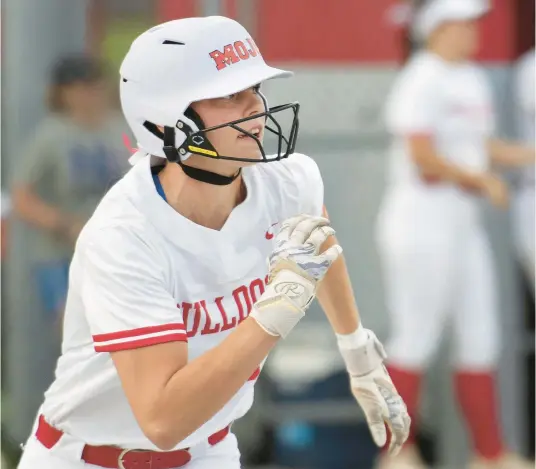  ?? MICHAEL GARD/POST-TRIBUNE ?? Crown Point’s Brinkley Kita runs toward first base during Tuesday’s Class 4A Crown Point Regional against Lake Central.