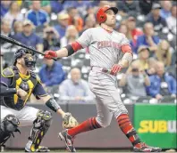  ?? CP/AP PHOTO ?? Cincinnati Reds’ Joey Votto hits a home run during the first inning of a game against the Milwaukee Brewers on Wednesday, Sept. 27, in Milwaukee.