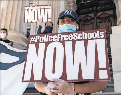  ?? Photo: Lev Radin/getty Images ?? Free schools: Protesters demonstrat­e on the steps of New York’s department of education, otherwise know as Tweed courthouse, demanding the removal of police officers from school.
