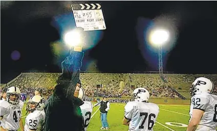  ?? LM OTERO AP ?? A movie slate marks the beginning of filming a scene for the movie “Friday Night Lights” in Odessa, Texas, in 2004.