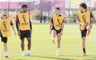  ?? — AFP ?? (From L) Belgium’s Dries Mertens, Michy Batshuayi, Eden Hazard and Axel Witsel take part in a training session at the Salwa Training Site in Salwa Beach, southwest of Doha.