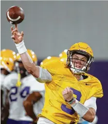  ?? Gerald Herbert / Associated Press ?? Joe Burrow, a junior transfer from Ohio State, is one of the quarterbac­k candidates at LSU.