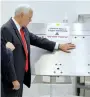  ?? Reuters ?? Mike Pence touches a piece of hardware with a warning label ‘Do Not Touch’ at the Kennedy Space Centre in Florida. —