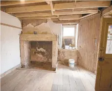  ??  ?? A room and a fireplace are seen inside a stone building under renovation in Seitzland Village outside of Glen Rock on March 18.