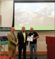  ?? DAN SOKIL — DIGITAL FIRST MEDIA ?? Philly Fade Factory owner Jaime Sierra, right, receives the Lansdale Business of the Month award from Mayor Andy Szekely, left, and Councilman Jason Van Dame.