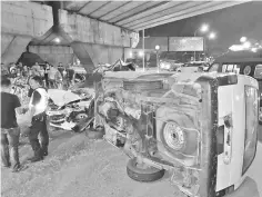  ??  ?? The collision between the van and the Perodua Myvi car under the Karamunsin­g flyover on Friday.