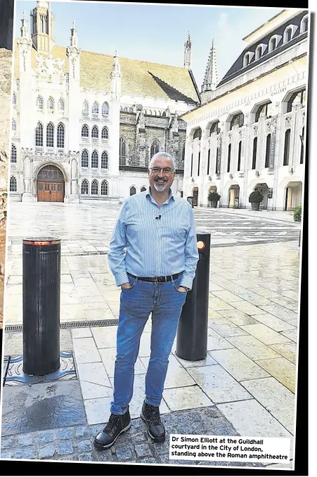  ?? ?? Dr Simon Elliott at the Guildhall courtyard in the City of London, standing above the Roman amphitheat­re