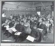  ?? (AP/National Archives) ?? In this undated photo provided by National Archives, first and second grade students sit in a classroom at the former Genoa Indian Industrial School.