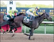  ?? Arkansas Democrat-Gazette/MITCHELL PE MASILUN ?? At the finish line, Classic Empire held a half-length advantage over Conquest Mo Money. He earned 100 Road to the Kentucky Derby points, enough to earn a spot in the Derby field.