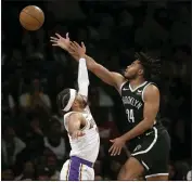  ?? JOHN MUNSON — THE ASSOCIATED PRESS ?? Returning Lakers guard Gabe Vincent, left, defends against Brooklyn's Cam Thomas in the first half Sunday.