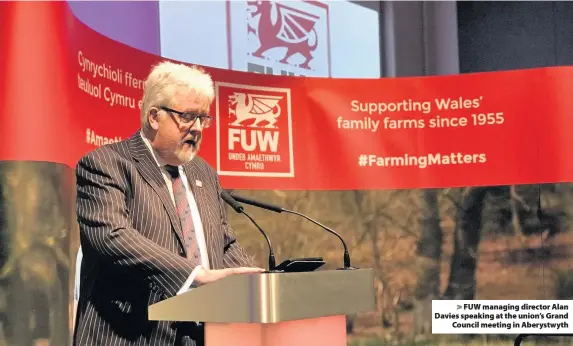  ??  ?? > FUW managing director Alan Davies speaking at the union’s Grand Council meeting in Aberystwyt­h