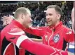  ??  ?? Team Canada skip Brad Gushue, right, celebrates with Geoff Walker after defeating Alberta 6-4 to win the Tim Hortons Brier, Sunday.