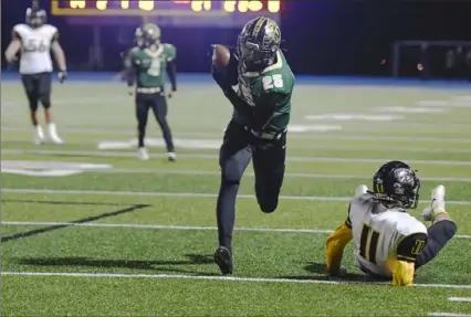  ?? Barry Reeger/For the Post-Gazette ?? Belle Vernon defender Quinton Martin intercepts a passs intended for Thomas Jefferson wide receiver Sean Sullivan in Belle Vernon’s 21-7 win in the WPIAL Class 4A semifinals Friday night at West Mifflin, High School.