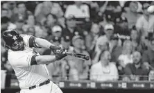  ??  ?? Astros designated hitter Tyler White connects on a solo home run during the fourth inning.