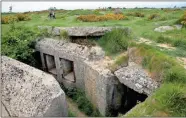  ??  ?? Remnants of a German World War II bunker overlookin­g Omaha Beach atop Pointe du Hoc in Saint-Pierre-du-Mont, Normandy, France, on Wednesday.