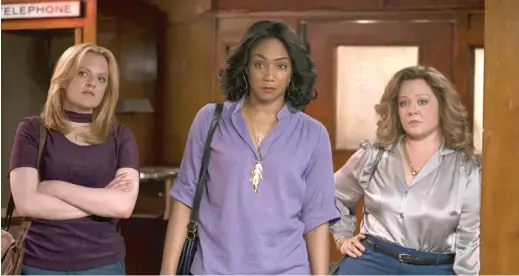  ?? NEW LINE PICTURES ?? Elisabeth Moss (from left), Tiffany Haddish and Melissa McCarthy turn criminal when their husbands are sentenced to prison in “The Kitchen.”