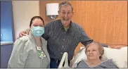  ?? Floyd Medical Center photo ?? Tammy Hanks, a unit secretary cross-trained as a certified nursing assistant at FMC, with Gene and Jane Mitchell.