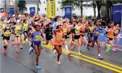  ?? MediaNews Group/Boston Herald/Getty Images ?? The oldest contested marathon in the world returns to a live event on Monday after a two-and-a-half-year pandemic hiatus. Photograph: