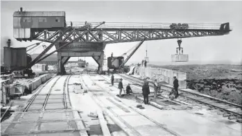  ??  ?? A busy scene on the North Breakwater, possibly in the 1930s, dominated by the 32 wheel Titan block-setting crane, which ran on four rails, but with two smaller cranes ably assisting and additional materials brought in by train. Near the end of the headshunt is a rake of wagons and a Hunslet 0-6-0T, probably Prince of Wales, the engine usually based here. Blocks stockpiled over the winter when conditions were deemed too dangerous for divers are seen to the right, they were approximat­ely 13ft x 7ft 6in x 6ft 6in and were cast from a combinatio­n of crushed granite, sand and Portland Cement. The two 40 ton Titan cranes of the North Breakwater project were a distance apart, that seen being the one that ran along the breakwater, gradually moving south as the building work progressed, and the other in the block stack works yard out of view to the left. Maud Railway Museum Collection