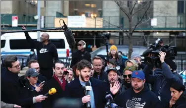  ?? (AP/Bryan Woolston) ?? Gavin Wax, leader of the New York Young Republican­s, addresses the press Monday in front of the New York Criminal Court building in New York during a rally in support of former President Donald Trump and in opposition to the potential criminal indictment against Trump sought by New York County District Attorney Alvin Bragg.