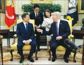  ?? Associated Press ?? President Donald Trump meets with South Korean President Moon Jae-in in the Oval Office of the White House in Washington on Friday.