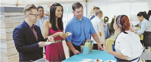  ?? PHOTO COURTESY OF BRAVO ?? REALITY DRAMA: From left, Richard Blais, Padma Lakshmi and Mayor Martin J. Walsh are seen during ‘Top Chef’ filming in 2014. A judge said he needs more evidence before allowing prosecutor­s to infer four Teamsters vandalized the TV show crew’s property.