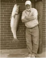 ??  ?? Dick Kohn, who provided the recollecti­ons and memories for this story, stands beside his 44¼-pound striper.