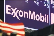  ?? Richard Drew / Associated Press ?? Energy stocks are leading U.S. indexes higher in early trading as the price of crude oil climb. Exxon Mobil added 1.2 percent early Monday, May 7, and Schlumberg­er rose 1.2 percent.