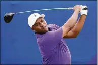  ?? Gerald Herbert / Associated Press ?? Harold Varner III has committed to play in the Travelers Championsh­ip. Here he follows his shot off the first tee during the final round of the PGA Zurich Classic at TPC Louisiana in Avondale, La., on April 24.