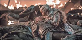  ?? HELEN SLOAN/HBO ?? Daenerys Targaryen (Emilia Clarke) mourns her fallen protector, Jorah Mormont (Iain Glen) in “The Long Night” episode of “Game of Thrones.”