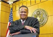  ??  ?? Federal Court Judge Morrison England Jr., the chief district judge for the Eastern District of California, poses at the Robert T. Matsui United States Courthouse in Sacramento, Calif. With an unfilled judicial vacancy and the same number of judicial...