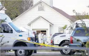  ?? JAY JANNER/ASSOCIATED PRESS ?? Investigat­ors work at the scene of a mass shooting at the First Baptist Church in Sutherland Springs, Texas, on Sunday. The gunman — a man in his early 20s — was later found dead elsewhere.