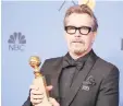  ??  ?? Gary Oldman with his trophy at the recent Globe Awards.