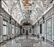  ??  ?? David Burdeny’s “Mirror Room, Palazzo Ducall, Mantova, Italy” (2016) is a haunting portrait of a Gothic Venetian palace.