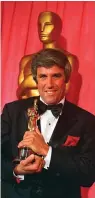  ?? The Associated Press ?? ■ Burt Bacharach stands with his Oscar for best original score for “Butch Cassidy and the Sundance Kid” at the 42nd annual Academy Awards in Los Angeles on April 7, 1970. Bacharach died of natural causes Wednesday at home in Los Angeles, publicist Tina Brausam said Thursday. He was 94.